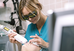 Woman having laser skin treatment